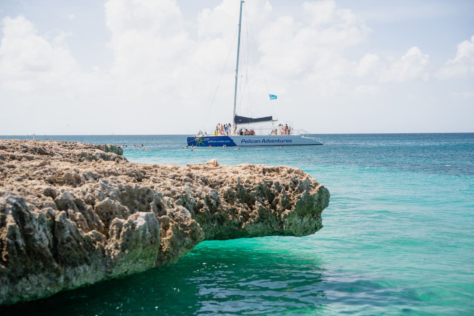 Catamaran on emerald water off the Aruba coast